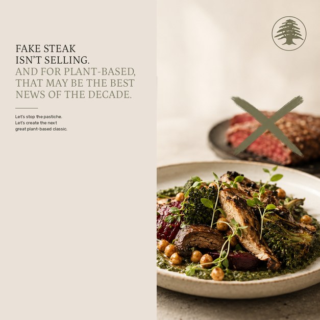 Plant-based plate of roasted vegetables and chickpeas on herb pesto, next to a crossed-out steak
